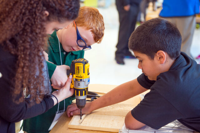 Associate Monica M. assists future engineers with their "drill skills"!